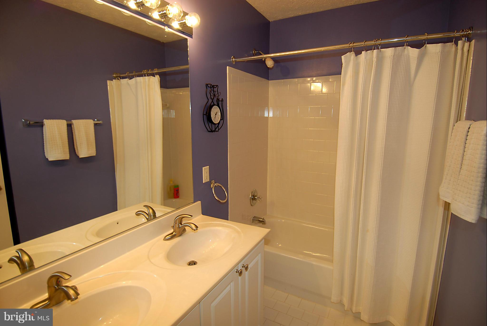 1200 Breckenridge Court Riva, MD 21140 - Photo 18 of 28 a bathroom with a sink and a mirror