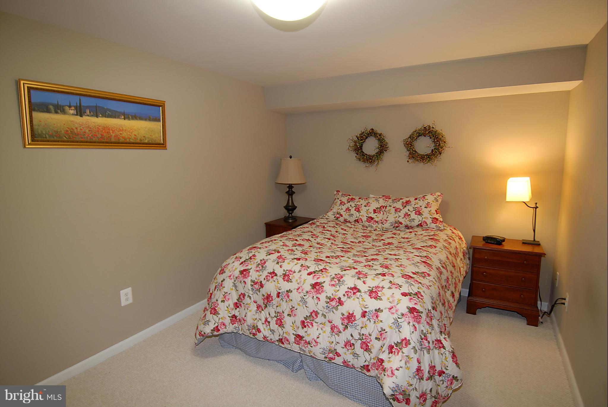1200 Breckenridge Court Riva, MD 21140 - Photo 21 of 28 a bedroom with a bed and a lamp on dresser