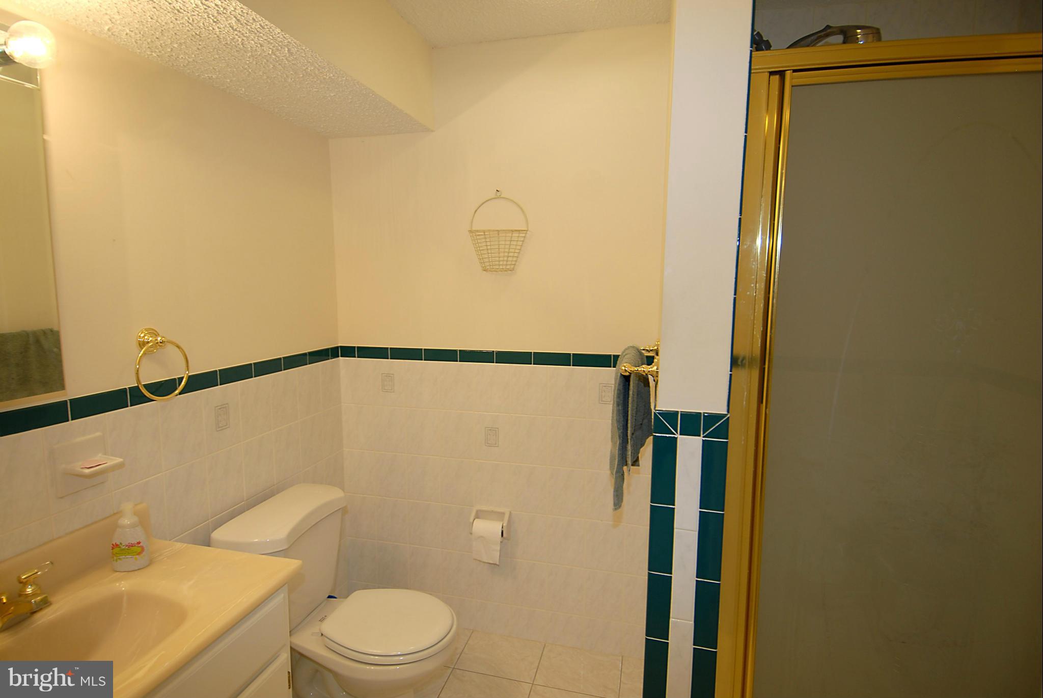 1200 Breckenridge Court Riva, MD 21140 - Photo 22 of 28 a white toilet sitting next to a bathroom sink