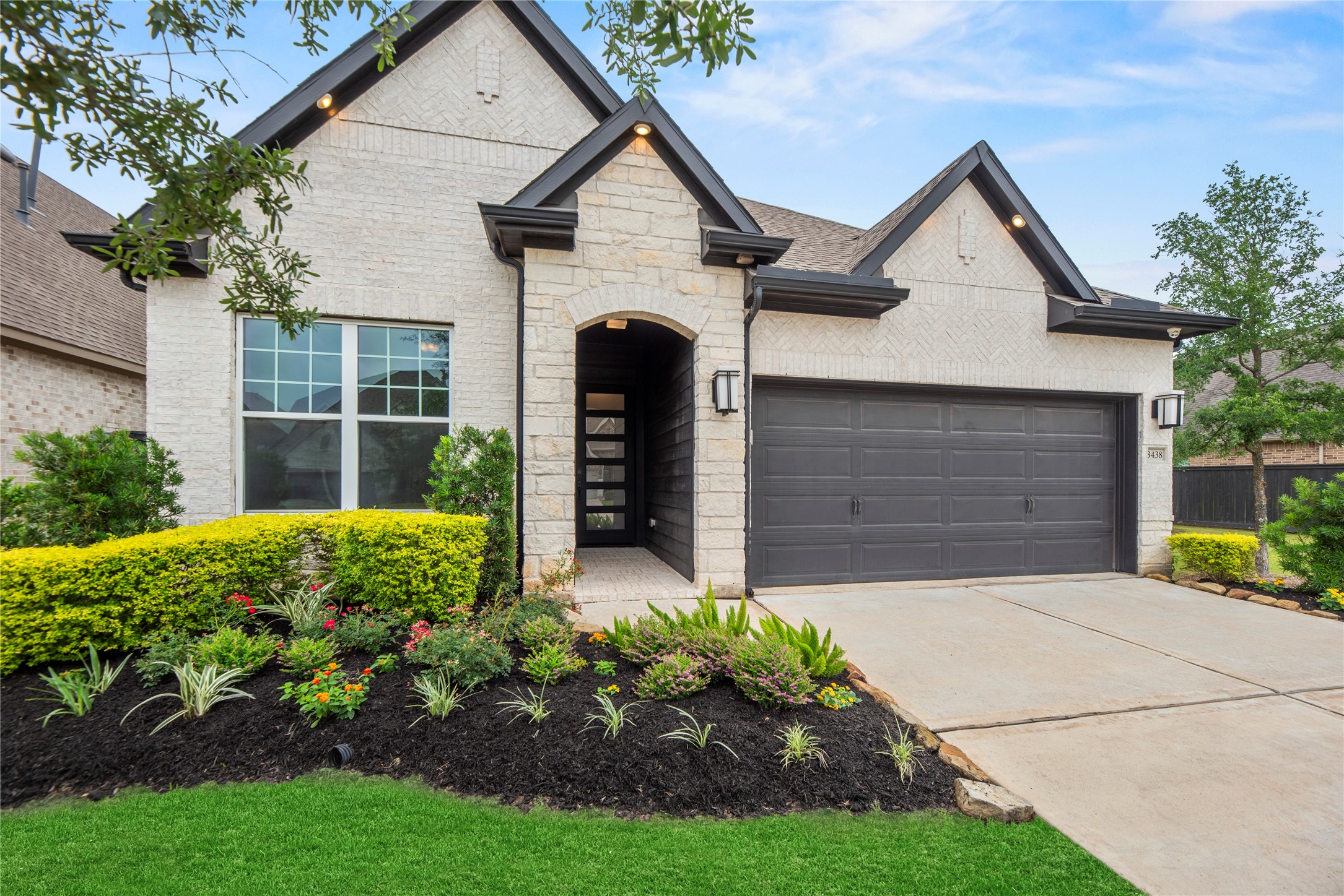 3438 Rich Radish Road Richmond, TX 77406 - Photo 1 of 25 Welcome to 3438 Rich Radish Road, a 'like-new' custom estate built by David Weekley Homes in the community of Harvest Green. This upgraded residence features a striking 8-foot modern front door, a spacious double-wide driveway, and professional soffit exterior landscape lighting.