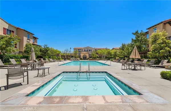 a view of a swimming pool with chairs