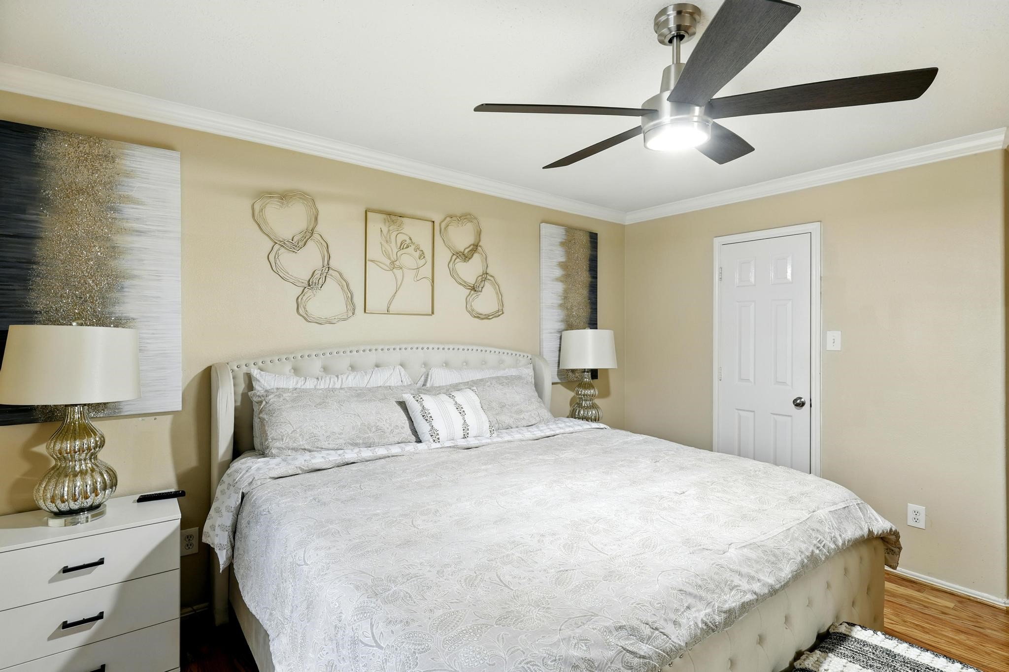 3002 Trinity Pass Court Spring, TX 77373 - Photo 15 of 22 Spacious and inviting, the primary bedroom features neutral tones, with ample space for oversized furniture.