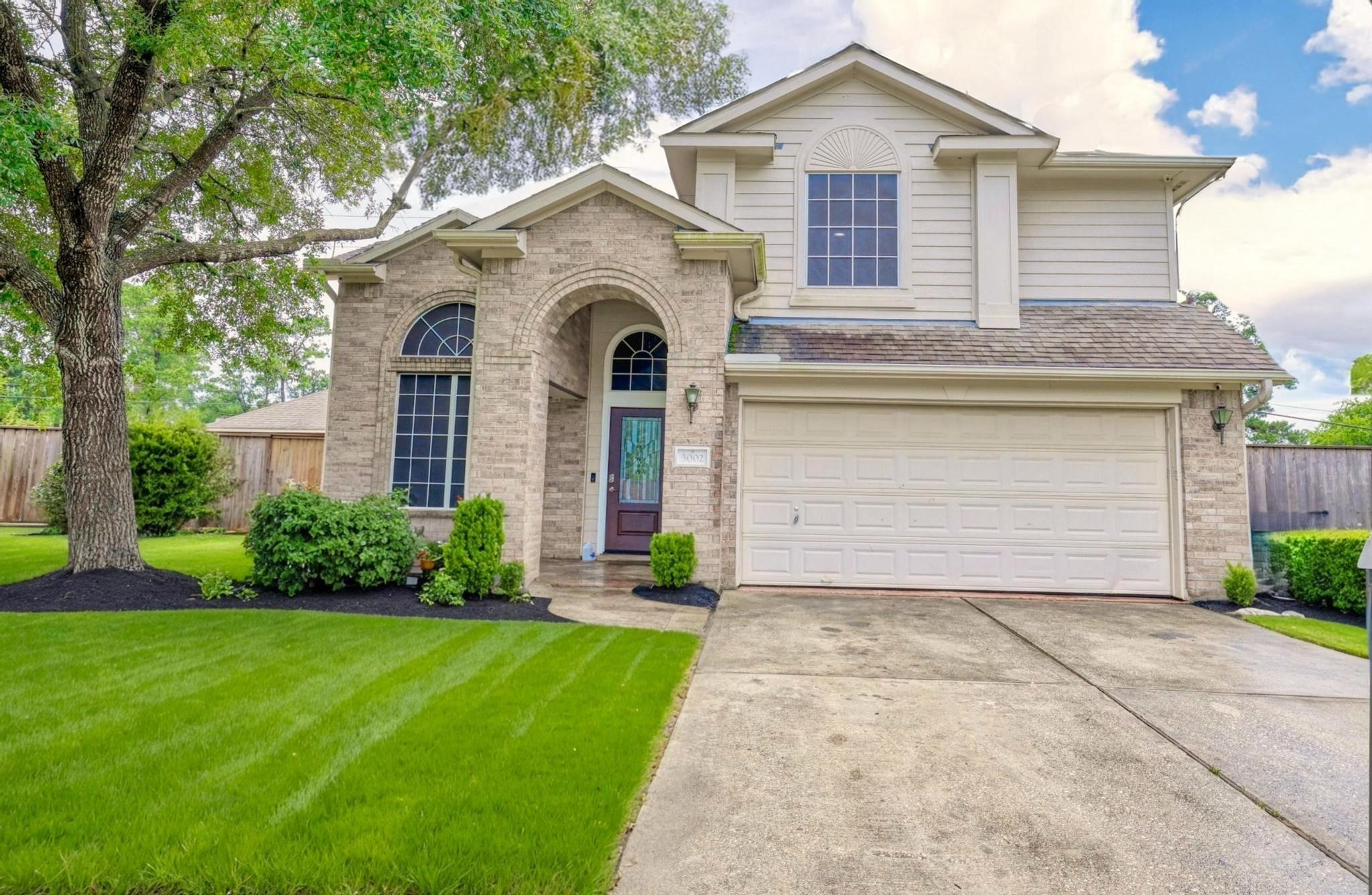 3002 Trinity Pass Court Spring, TX 77373 - Photo 2 of 22 Welcome to 3002 Trinity Pass Court, a charming two-story home nestled on a quiet cul-de-sac in the heart of Spring, TX. Curb appeal with mature trees, manicured landscaping, this home offers a warm and inviting first impression.