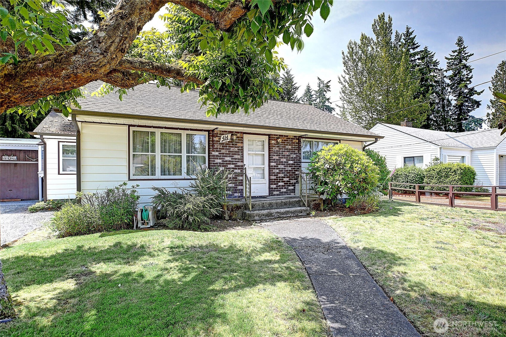 414 Morgan Road Everett, WA 98203 - Photo 1 of 26 a view of backyard with a garden and plants