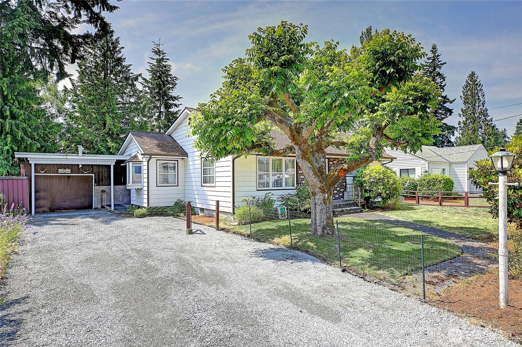 414 Morgan Road Everett, WA 98203 - Photo 24 of 26 a view of a house with backyard and a tree