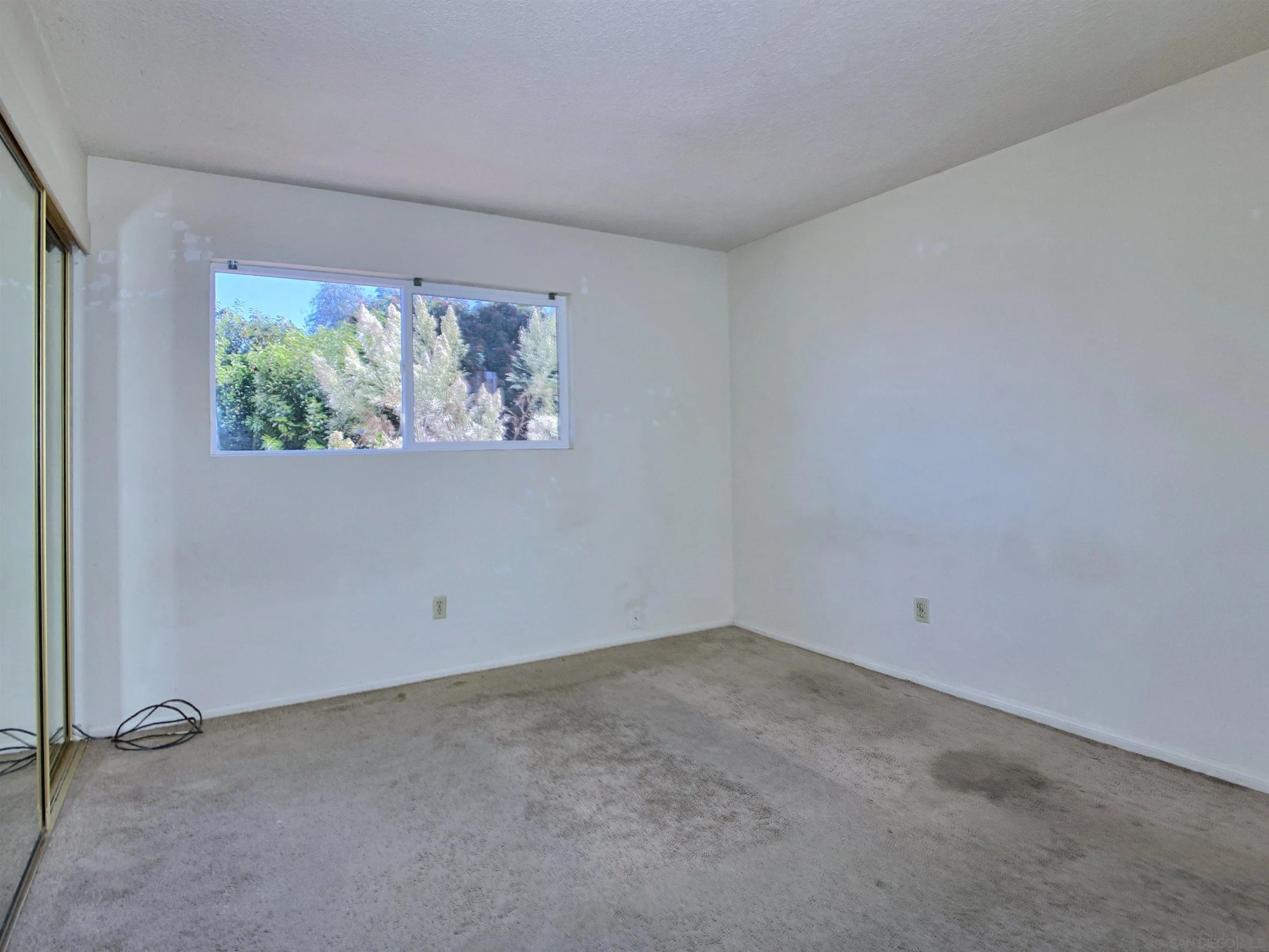 9443 Pebble Beach Drive Santee, CA 92071 - Photo 11 of 16 an empty room with a window