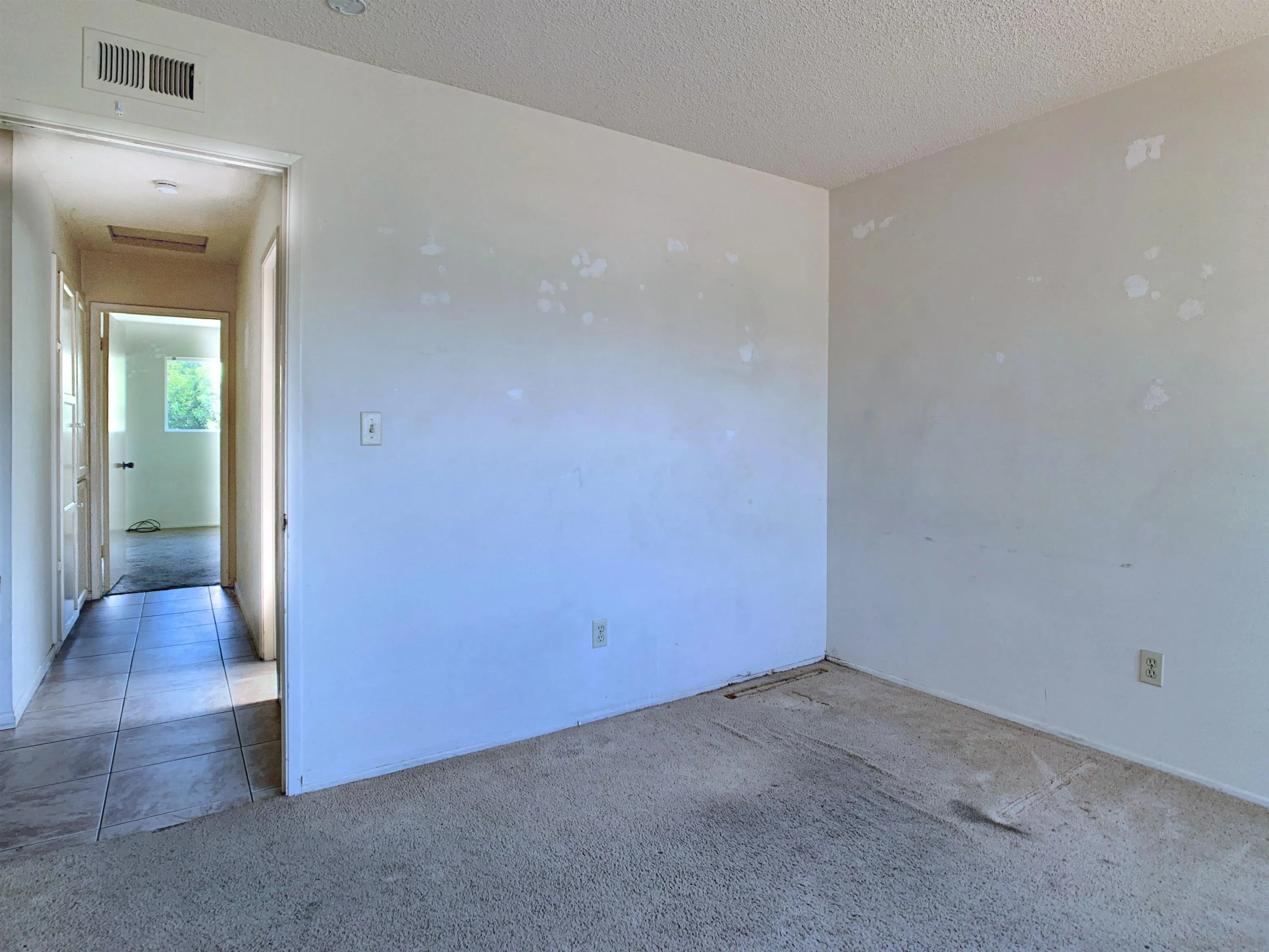 9443 Pebble Beach Drive Santee, CA 92071 - Photo 12 of 16 an empty room with wooden floor and a sink