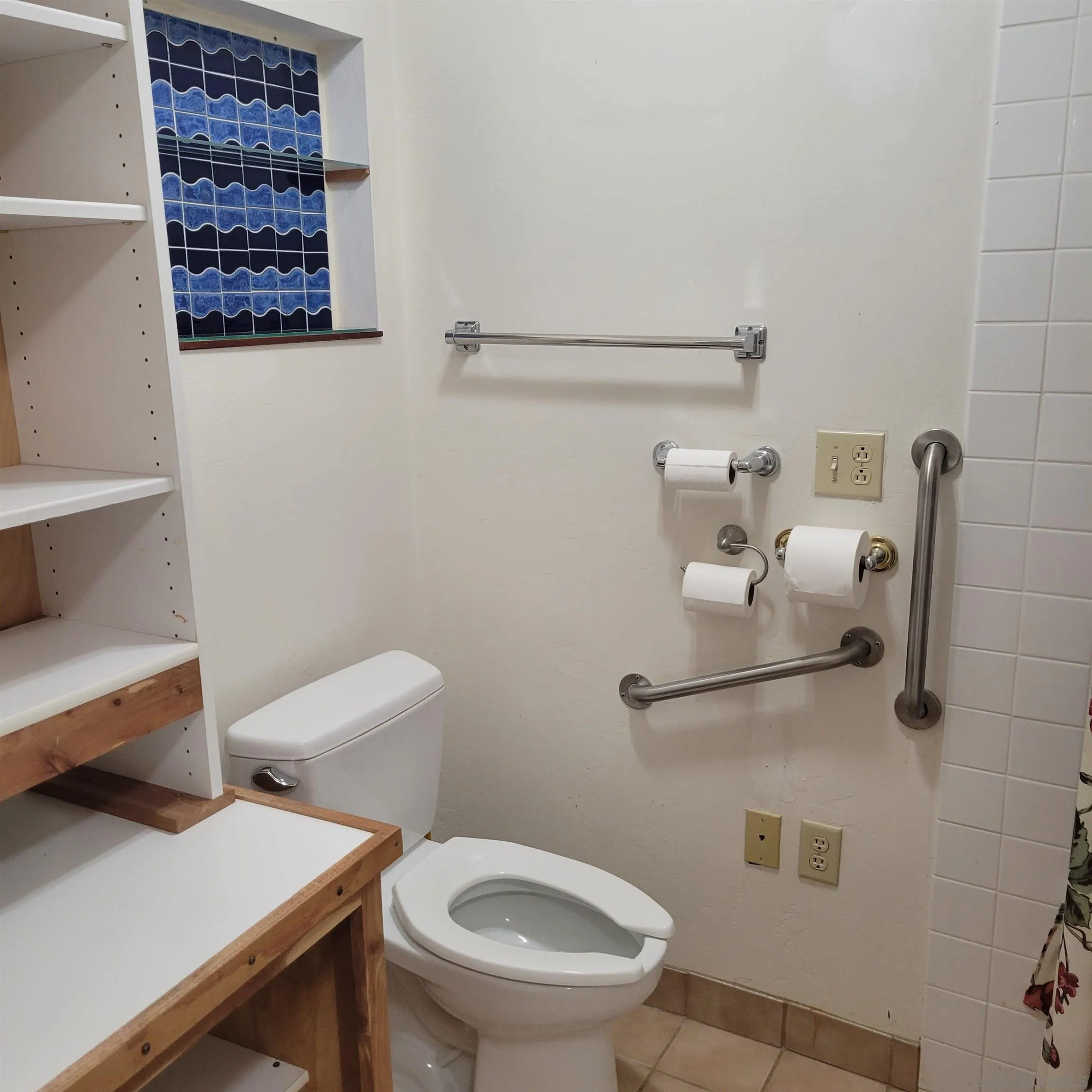 9443 Pebble Beach Drive Santee, CA 92071 - Photo 15 of 16 a white toilet sitting next to a bathroom sink