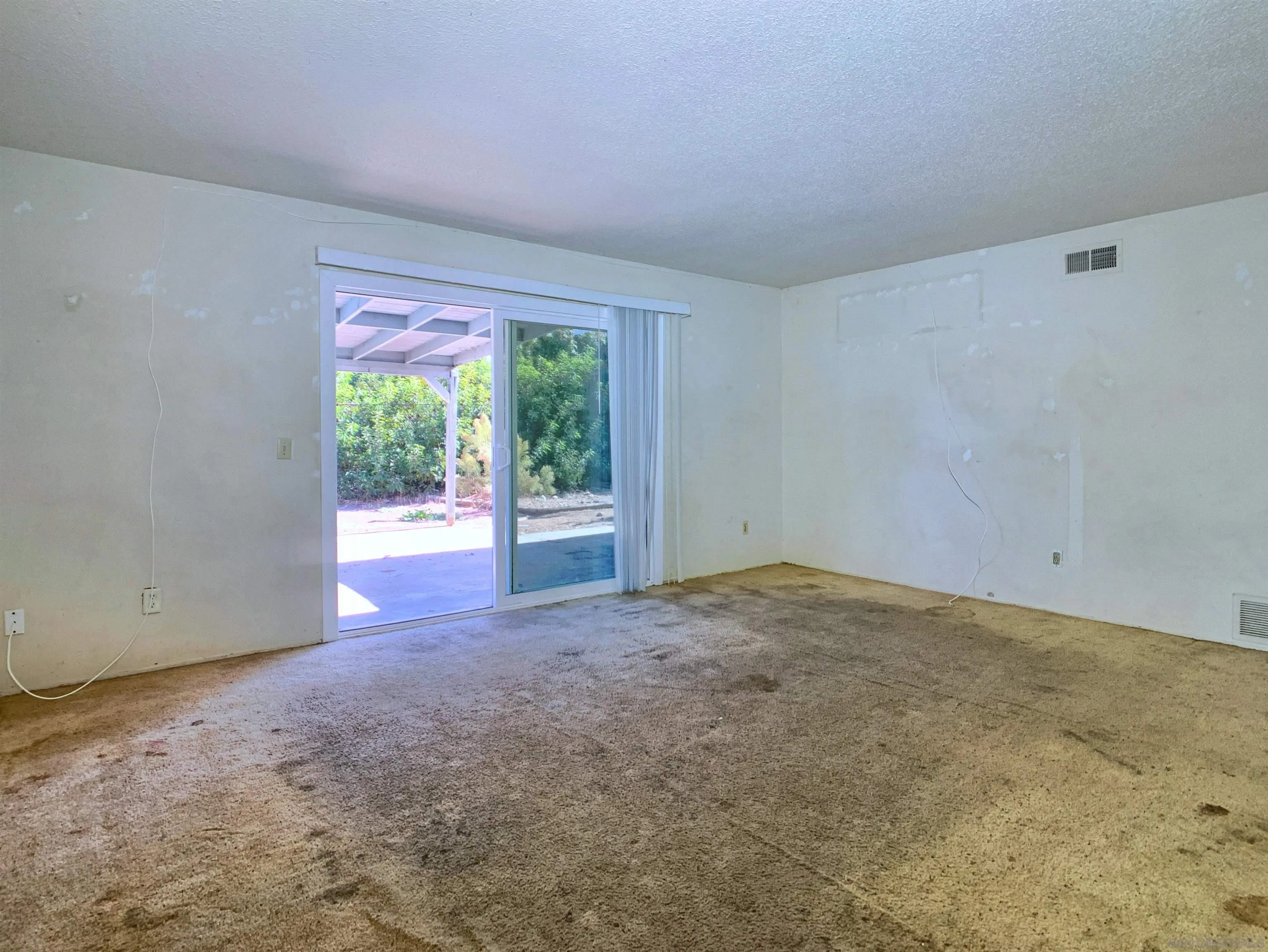 9443 Pebble Beach Drive Santee, CA 92071 - Photo 6 of 16 a view of an empty room with a window