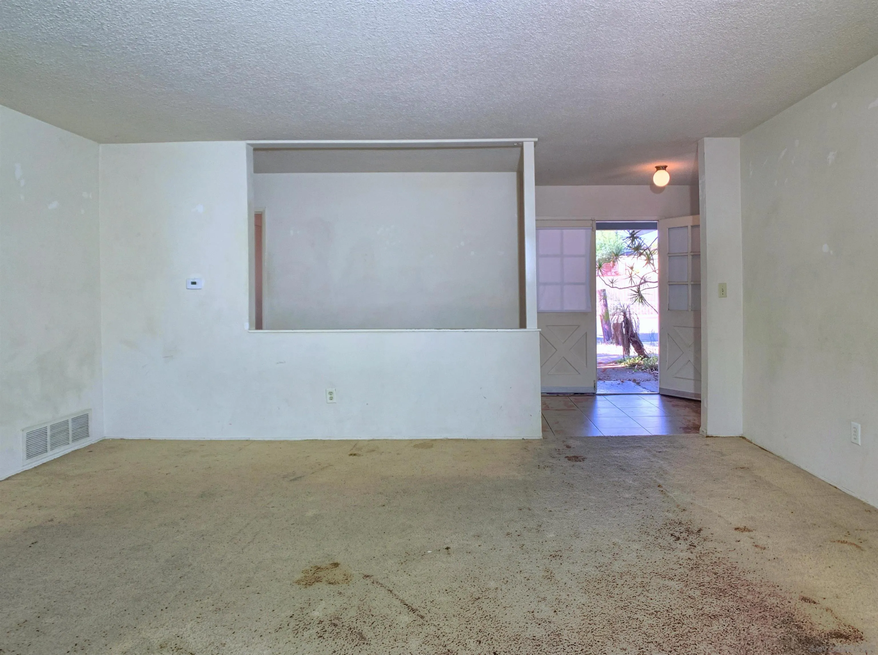 9443 Pebble Beach Drive Santee, CA 92071 - Photo 8 of 16 an empty room with wooden floor and windows