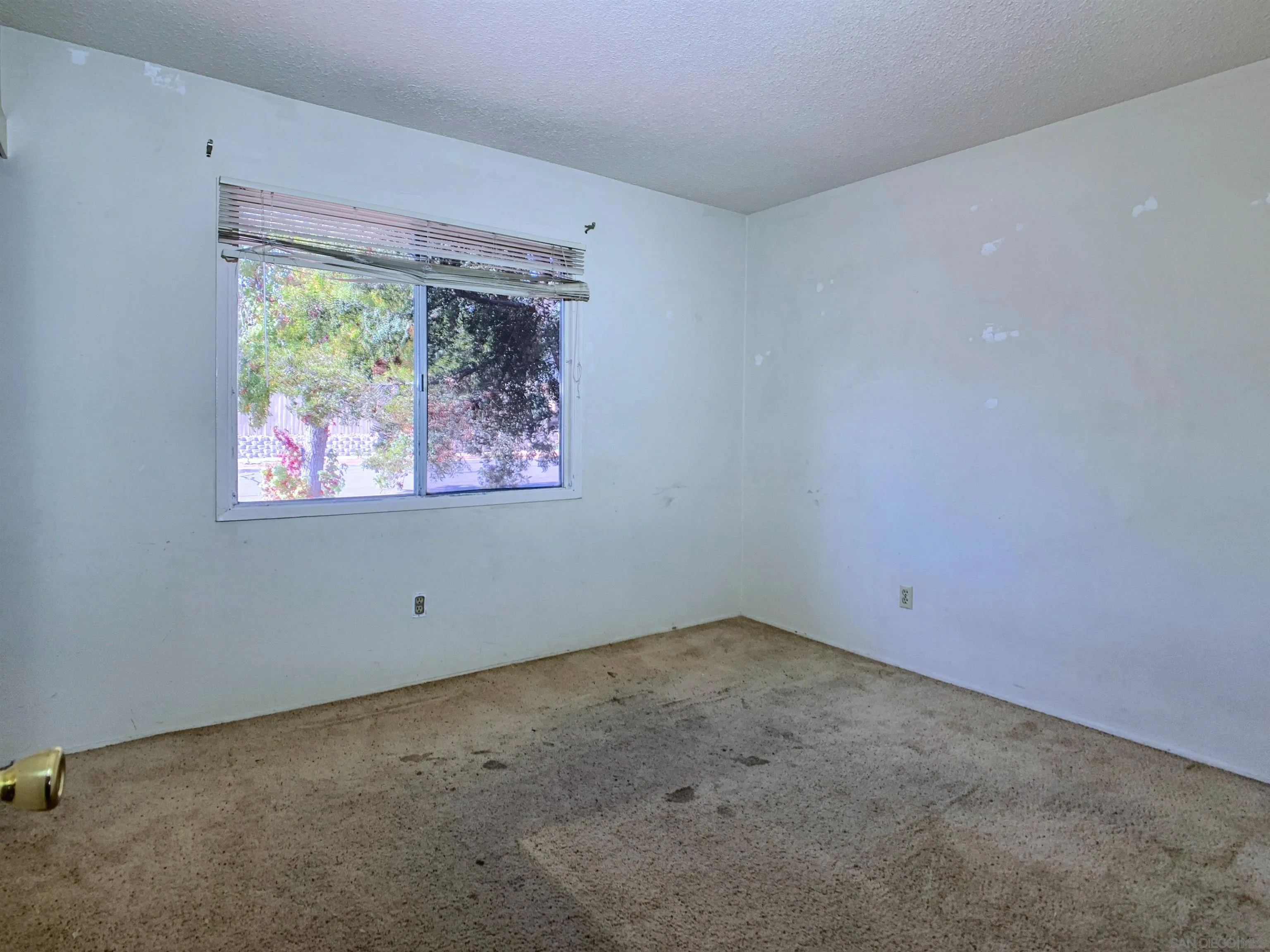 9443 Pebble Beach Drive Santee, CA 92071 - Photo 9 of 16 an empty room with a window
