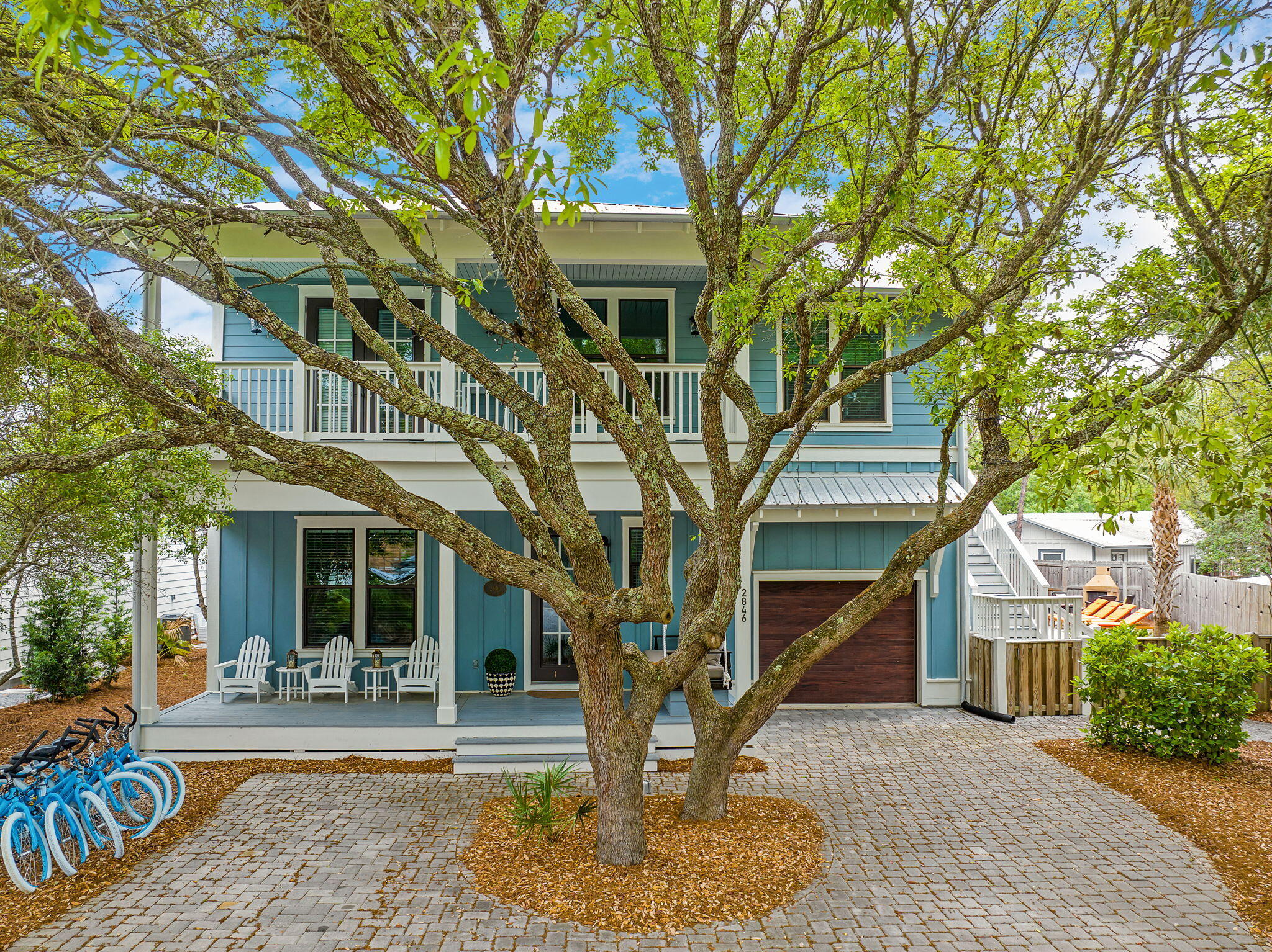 2846 South County Highway 395 Santa Rosa Beach, FL 32459 - Photo 6 of 19 a front view of a house with garden