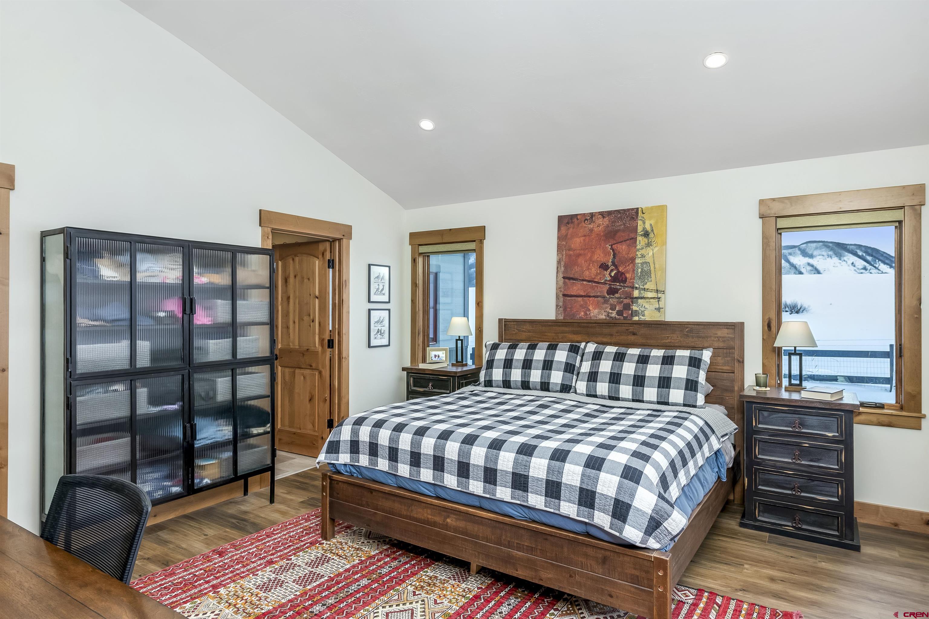 48 Elk Valley Road, Unit B Crested Butte, CO 81224 - Photo 12 of 34 a bedroom with a bed and a window