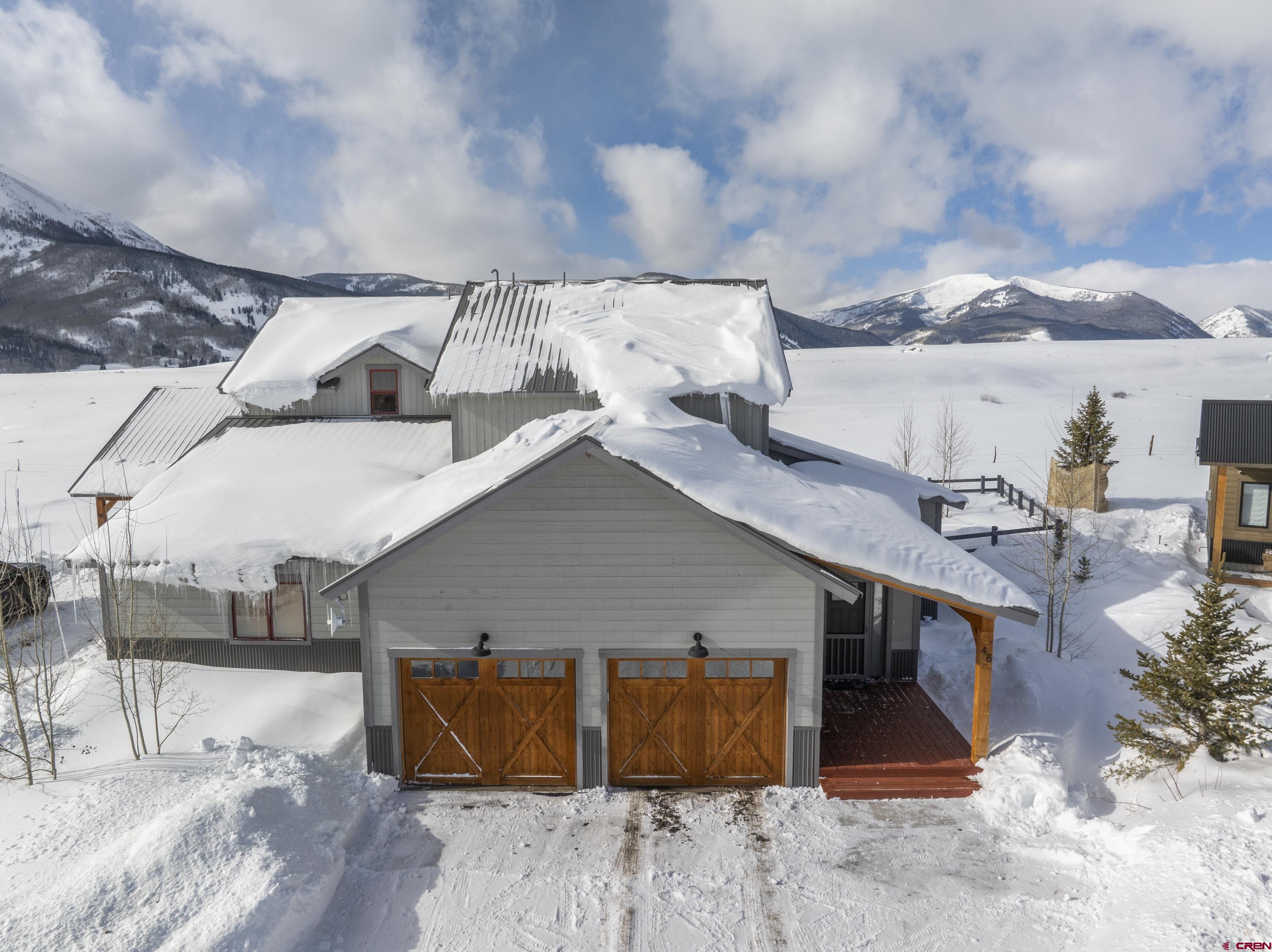 48 Elk Valley Road, Unit B Crested Butte, CO 81224 - Photo 27 of 34 a view of a house with roof