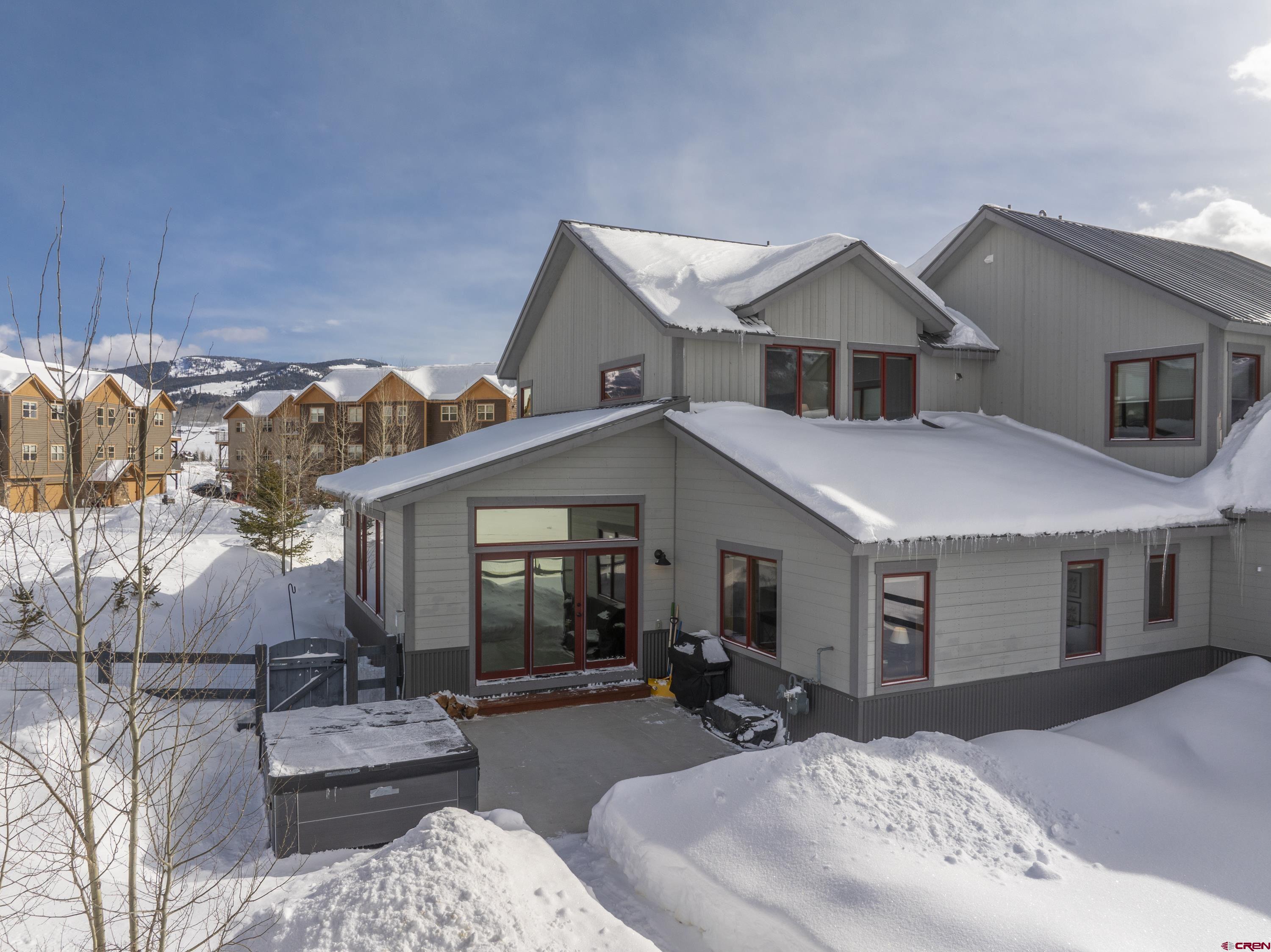 48 Elk Valley Road, Unit B Crested Butte, CO 81224 - Photo 29 of 34 a view of a house with couches chairs and wooden floor