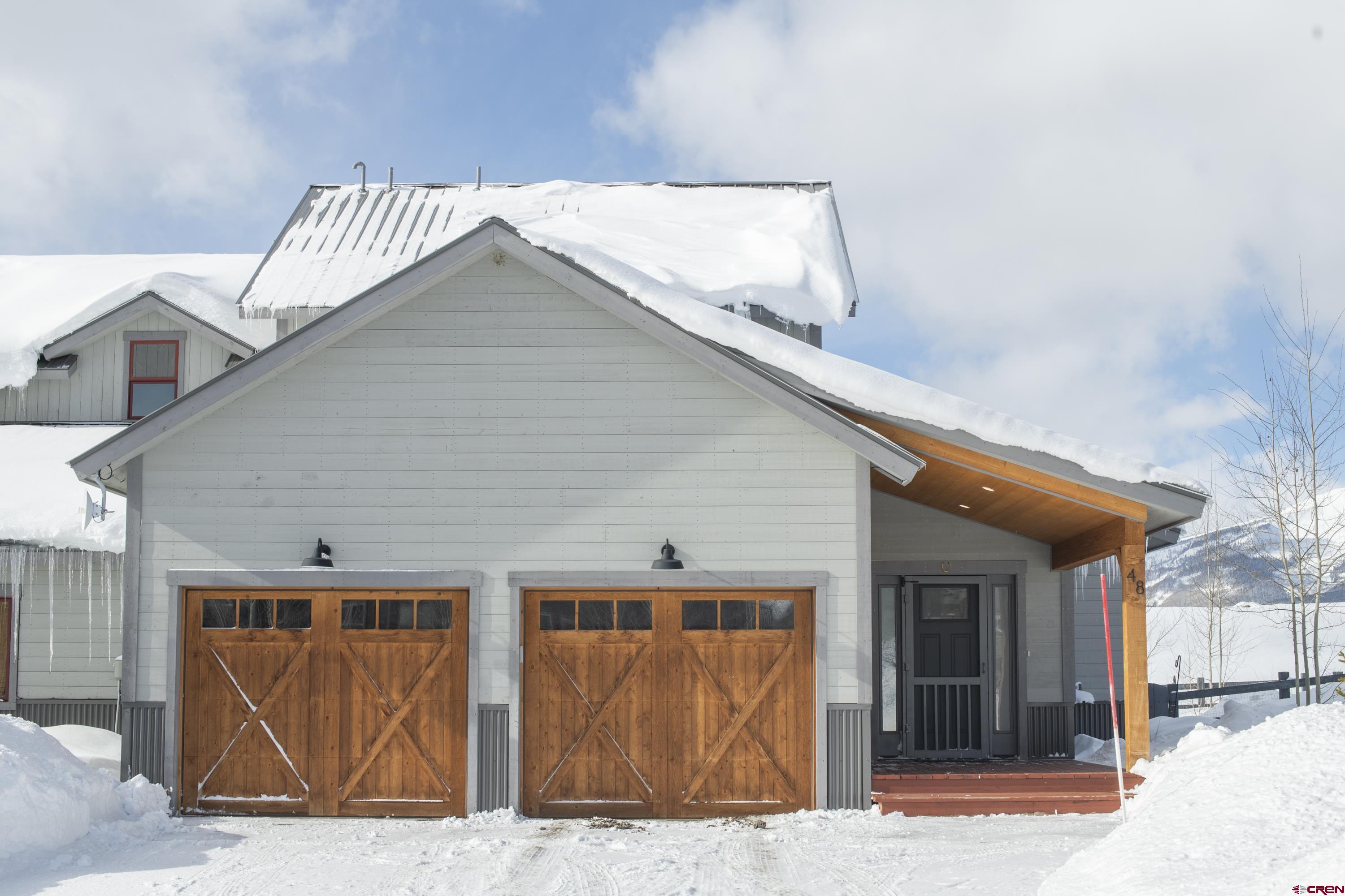 48 Elk Valley Road, Unit B Crested Butte, CO 81224 - Photo 31 of 34 a front view of a house
