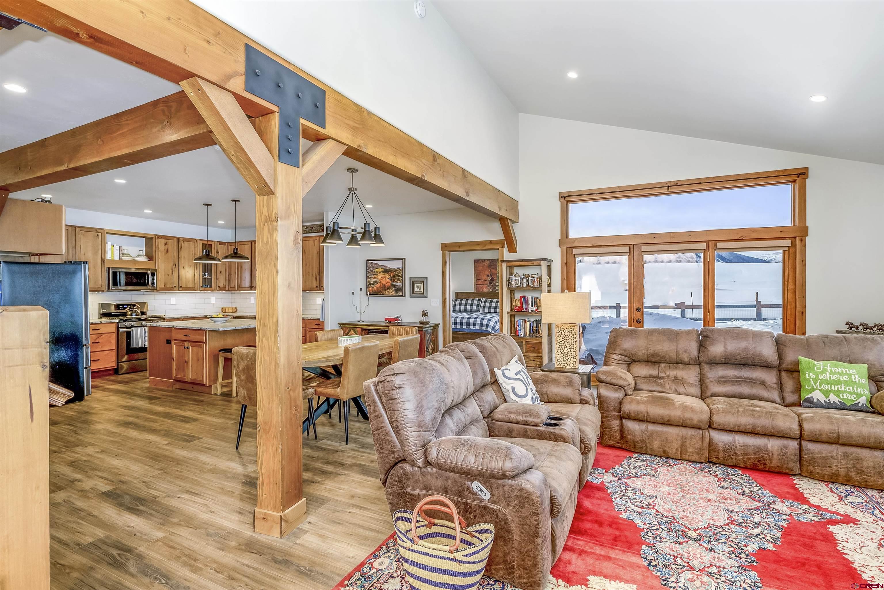 48 Elk Valley Road, Unit B Crested Butte, CO 81224 - Photo 5 of 34 a living room with furniture and a large window