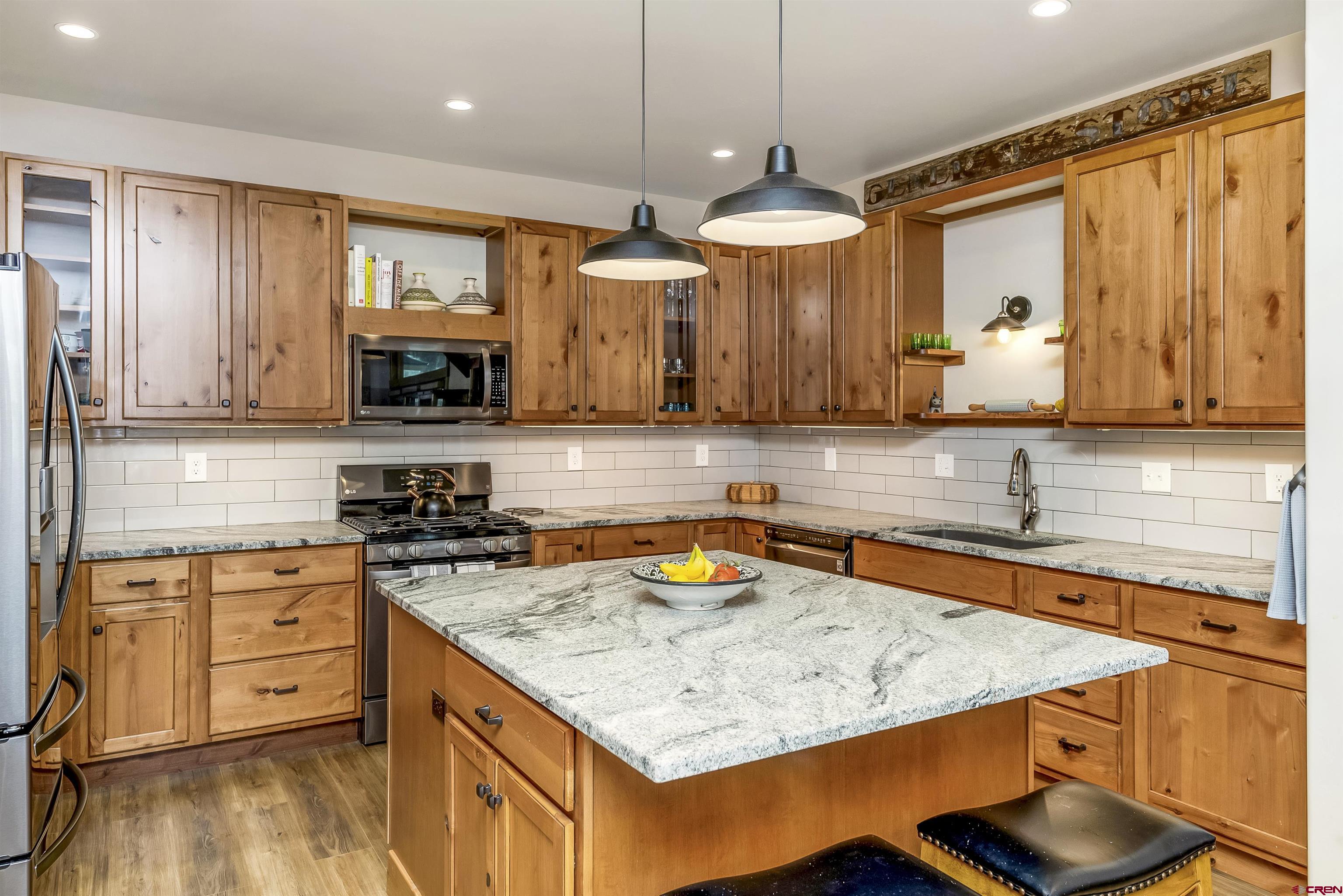 48 Elk Valley Road, Unit B Crested Butte, CO 81224 - Photo 7 of 34 a kitchen with stainless steel appliances granite countertop a sink stove and refrigerator