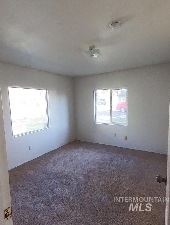 418 13th Street Clarkston, WA 99403 - Photo 22 of 26 Spare room with dark colored carpet