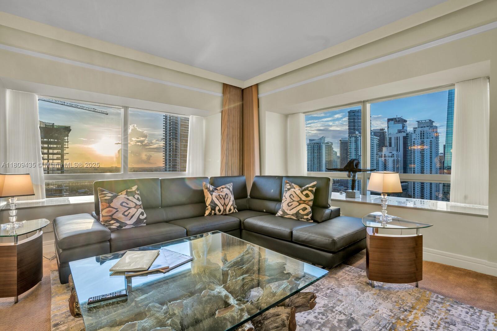 1435 Brickell Avenue, Unit 3012 Miami, FL 33131 - Photo 9 of 73 a living room with furniture and a large window