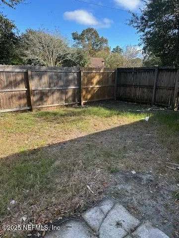 a view of a backyard with a small cabin