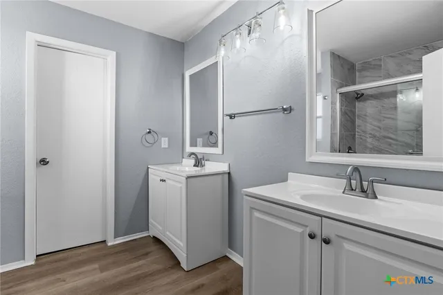 a bathroom with a sink and mirror