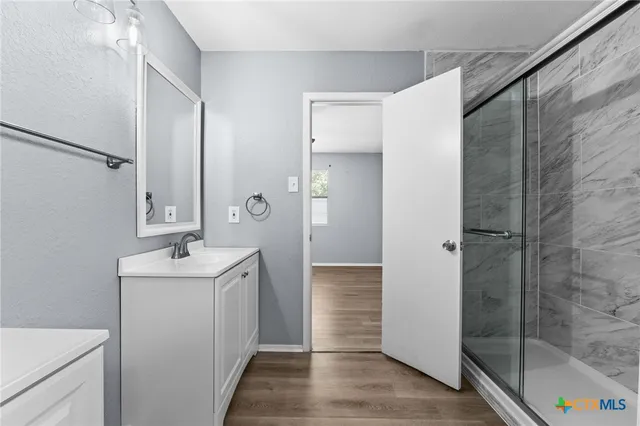 a bathroom with a sink and mirror