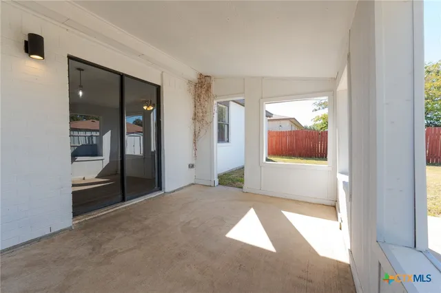 a view of an empty room and window