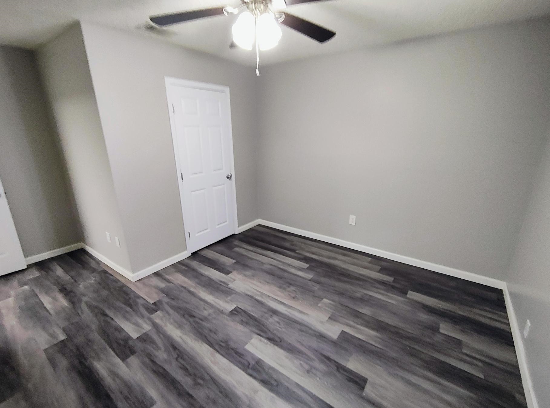 858 Pendleton Street Memphis, TN 38114 - Photo 2 of 10 wooden floor in an empty room