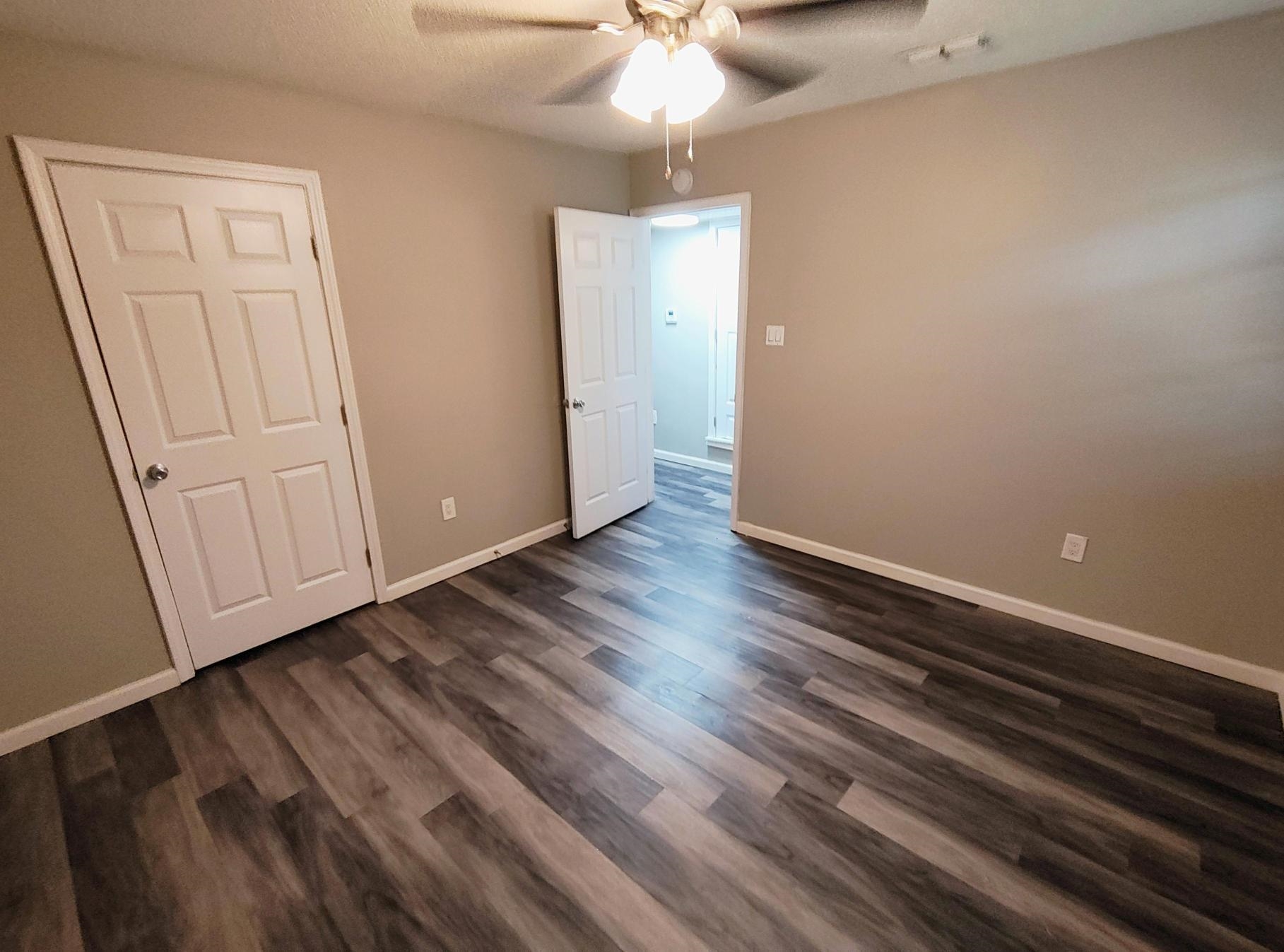 858 Pendleton Street Memphis, TN 38114 - Photo 4 of 10 wooden floor in an empty room