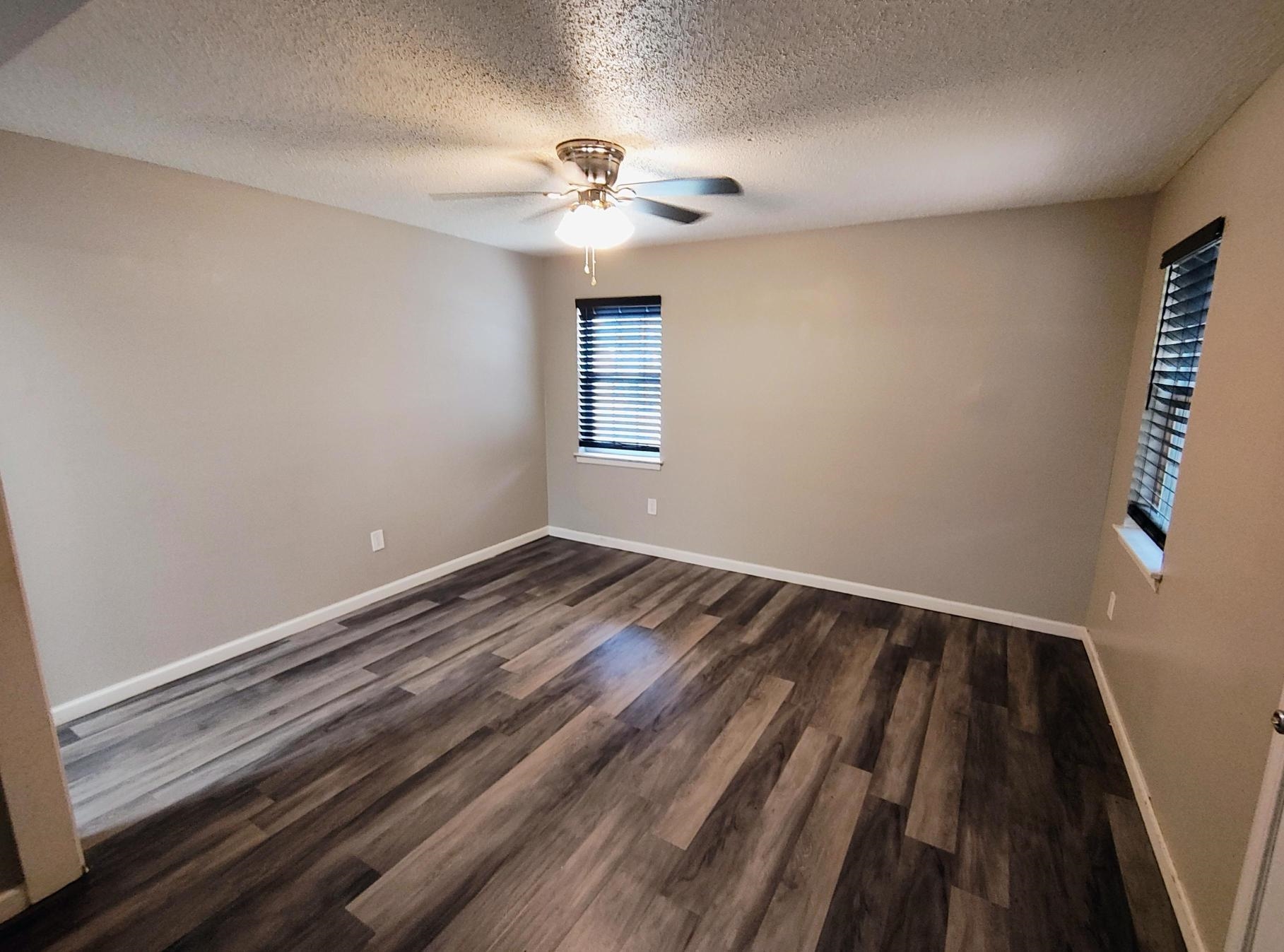 858 Pendleton Street Memphis, TN 38114 - Photo 7 of 10 wooden floor in an empty room with a window