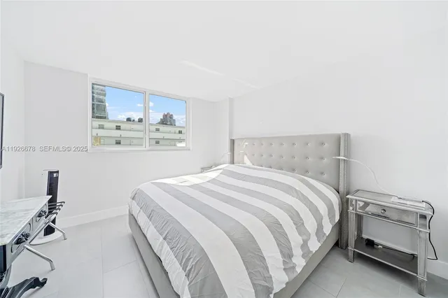 a bedroom with a bed and a cabinets