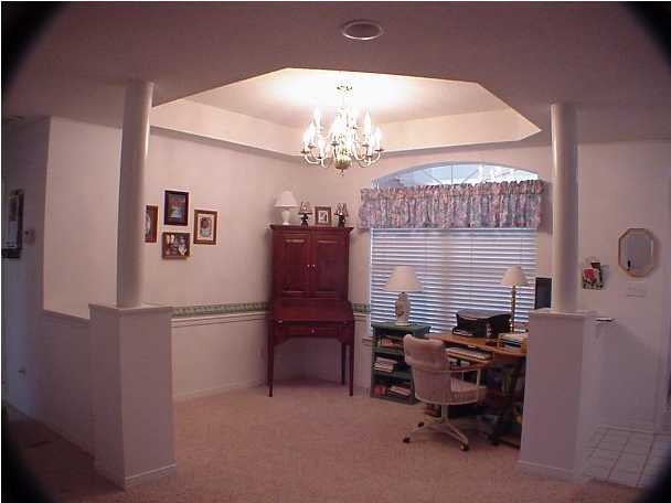 4462 Kingslynn Road Niceville, FL 32578 - Photo 5 of 15 a dining room with furniture and chandelier
