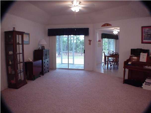 4462 Kingslynn Road Niceville, FL 32578 - Photo 6 of 15 a living room with furniture and a flat screen tv