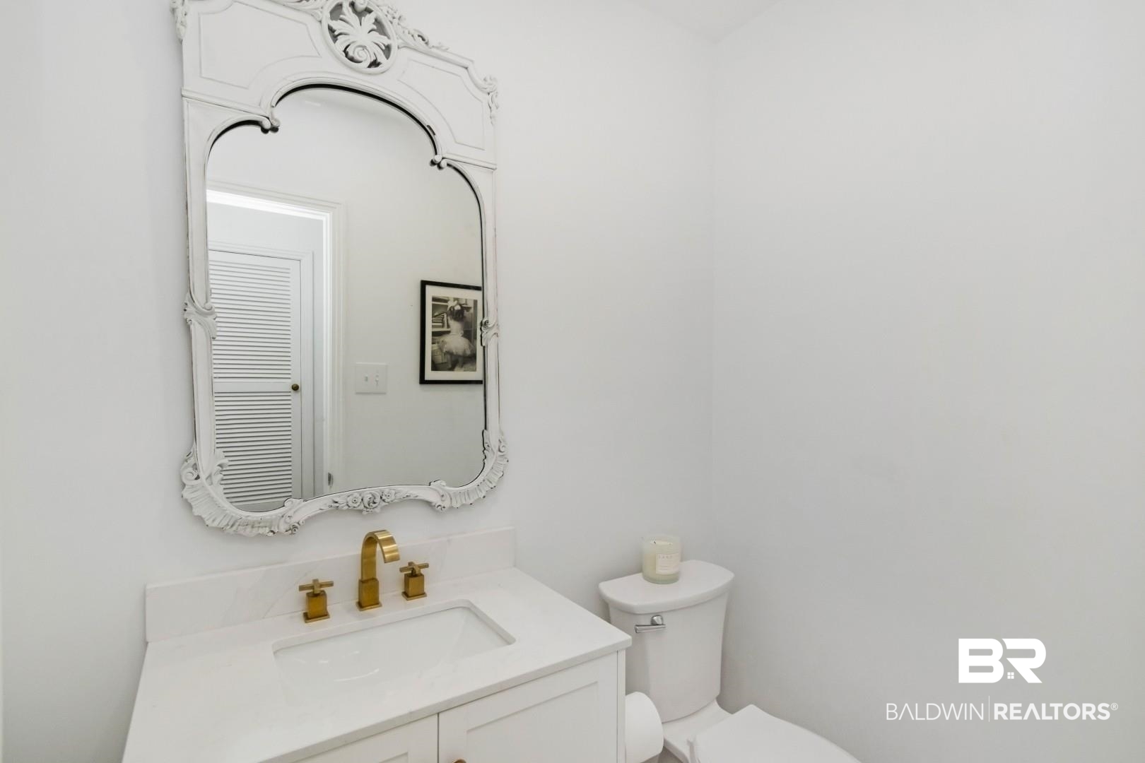 4596 Hawthorne Place Mobile, AL 36608 - Photo 15 of 34 White vanity with integrated sink, gold-finish faucet, and coordinating hardware
