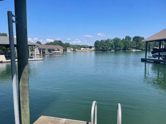 a sign that is sitting on a green field