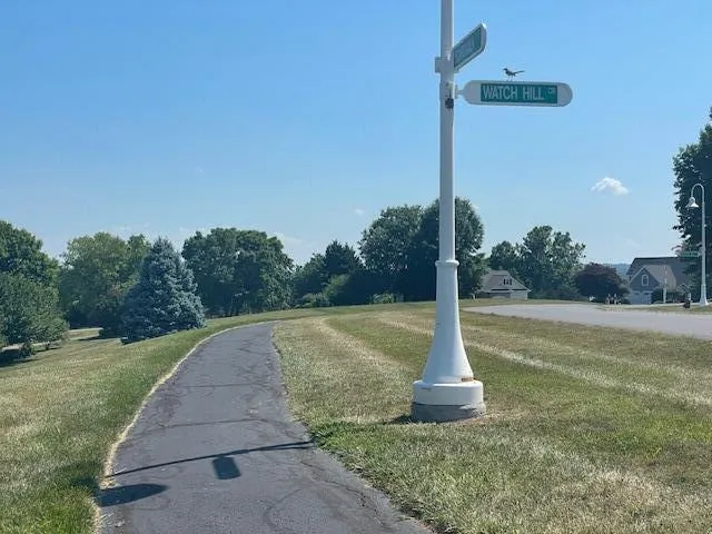 a front view of house with yard and staircase