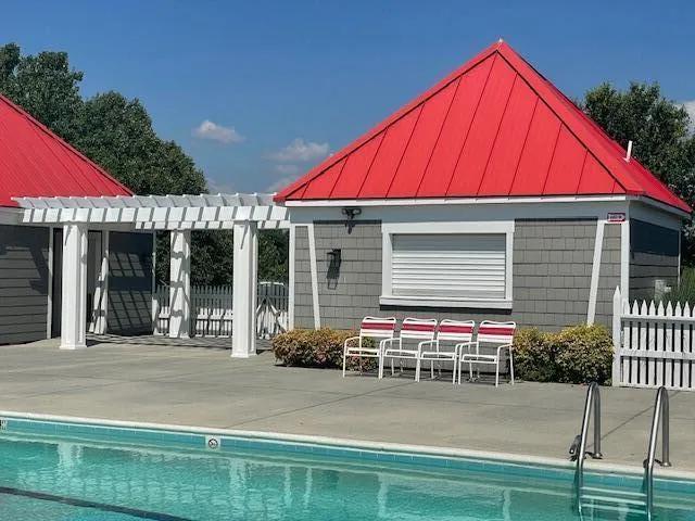 a view of a swimming pool with a patio