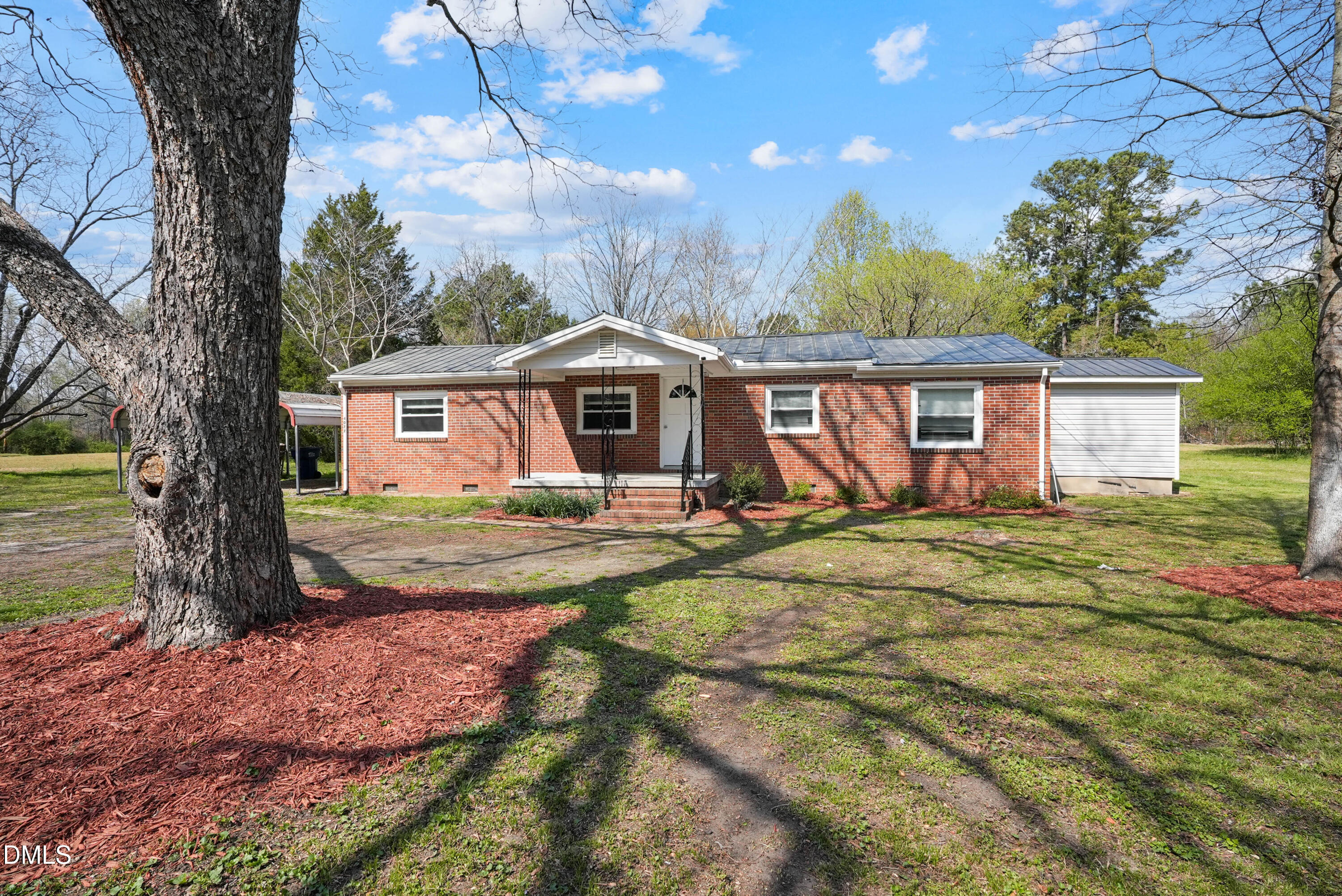 4077 Vass-Carthage Road Carthage, NC 28327 - Photo 2 of 23 a view of a house with backyard and sitting area