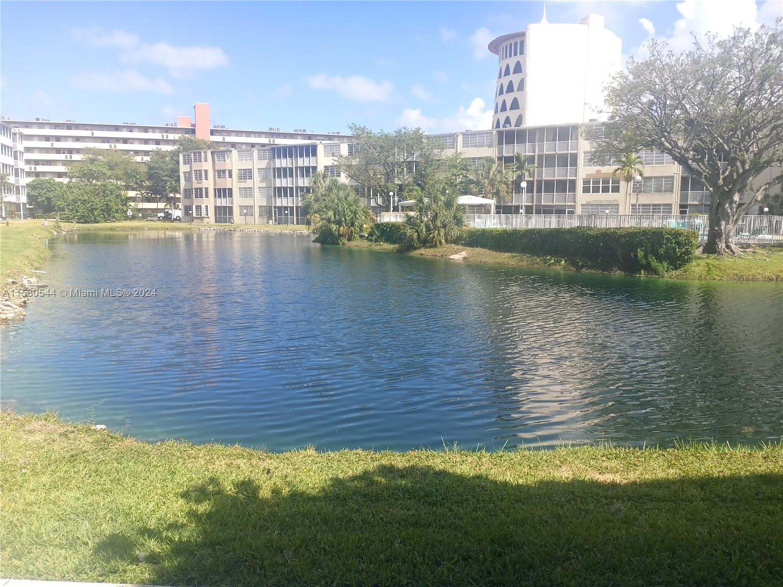a view of a lake with tall building