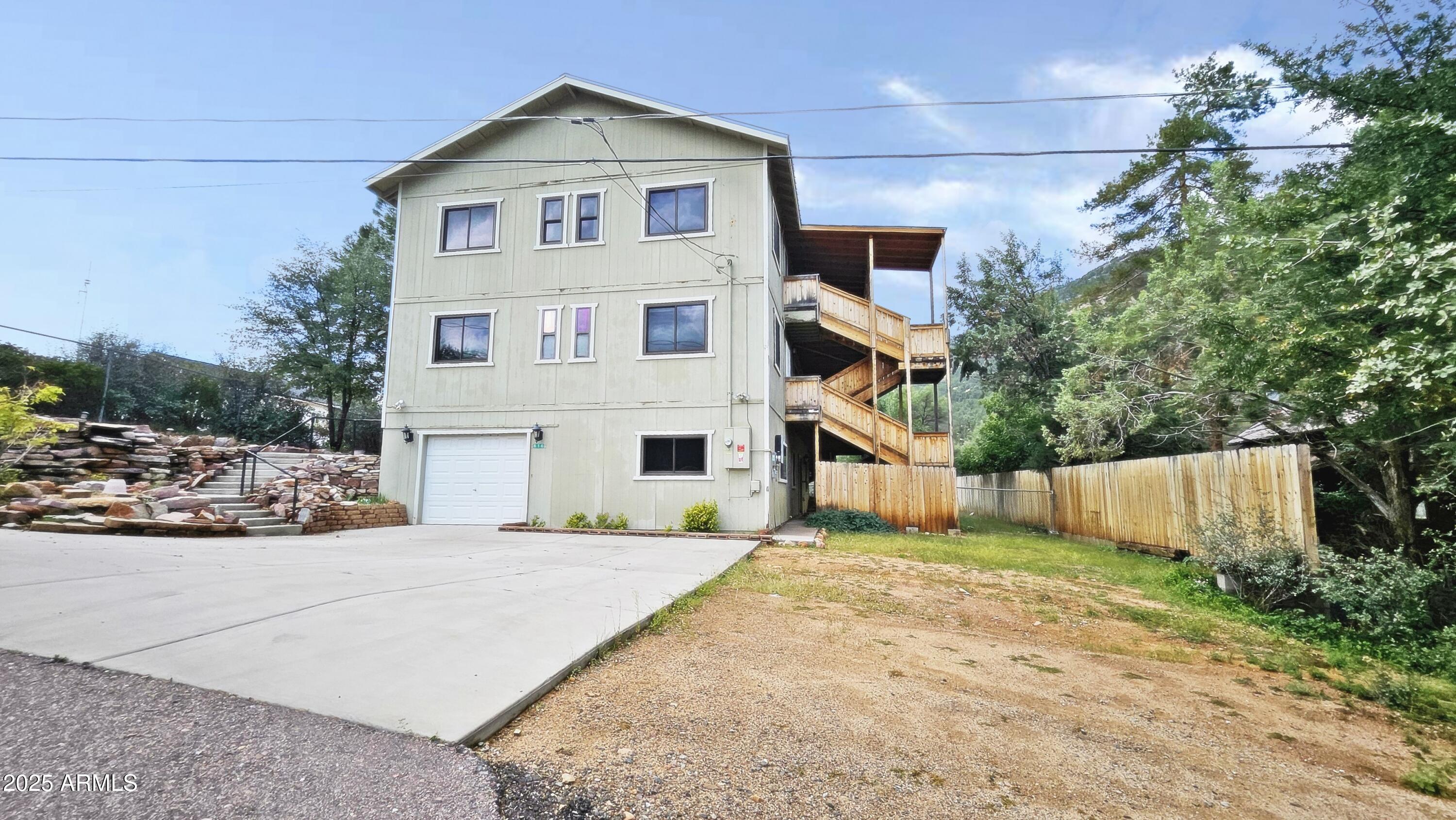 616 Verde Place Payson, AZ 85541 - Photo 2 of 29 a front view of a house with a yard and garage