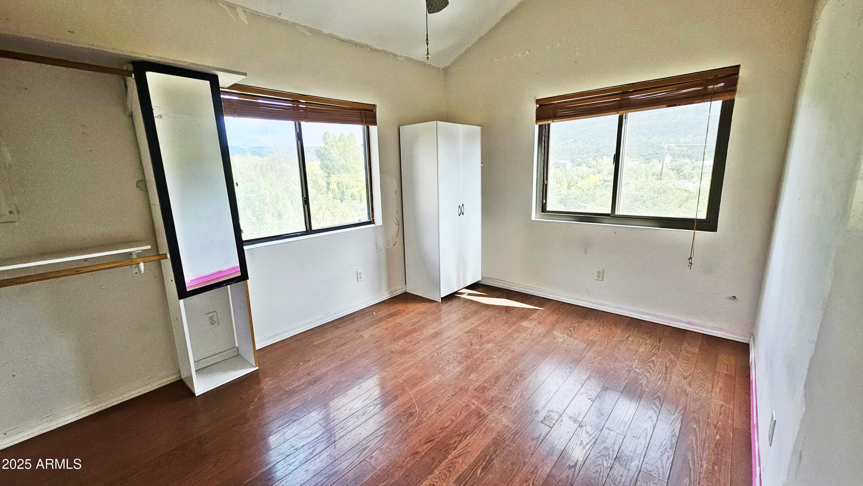 616 Verde Place Payson, AZ 85541 - Photo 22 of 29 an empty room with wooden floor and windows