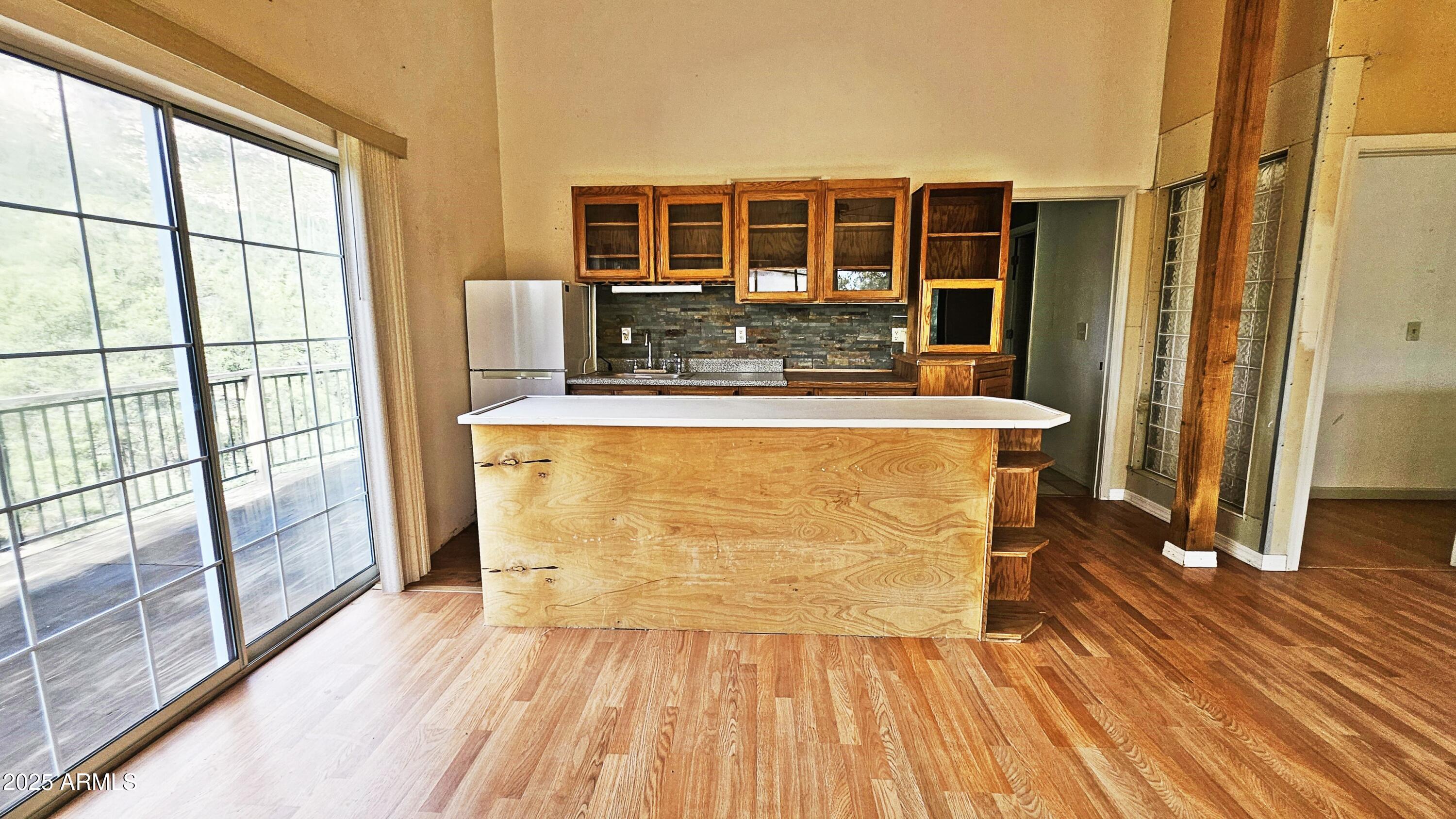 616 Verde Place Payson, AZ 85541 - Photo 27 of 29 a view of kitchen with wooden floor and large window
