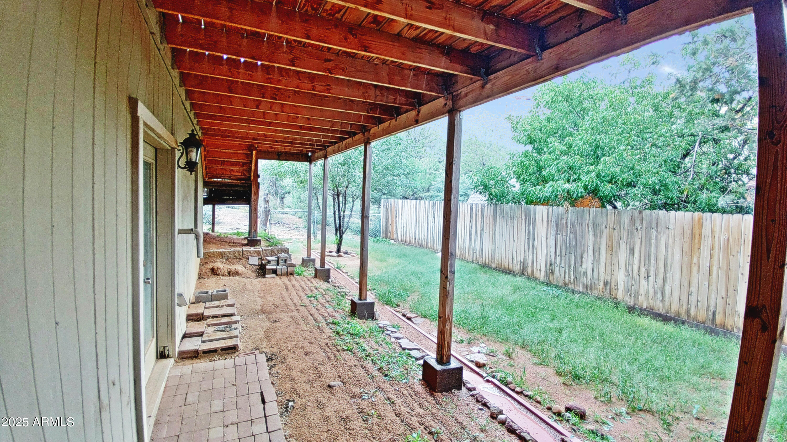 616 Verde Place Payson, AZ 85541 - Photo 3 of 29 a view of a backyard with wooden fence and a porch