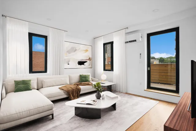 a view of a patio with couches table and chairs potted plants