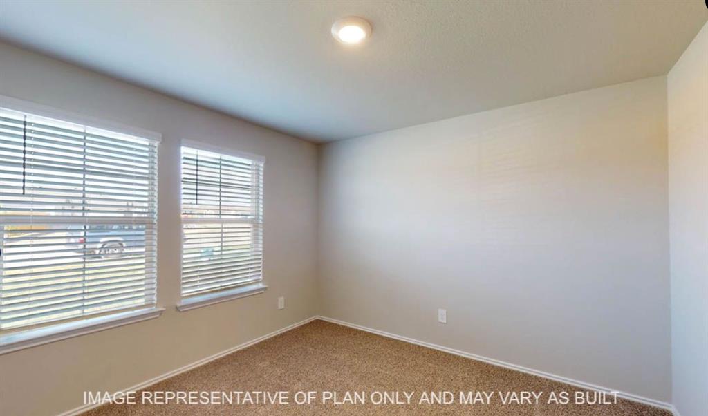 10204 Neptune Court Waco, TX 76708 - Photo 16 of 20 Bright room featuring two windows with horizontal blinds, neutral wall paint, and carpet flooring