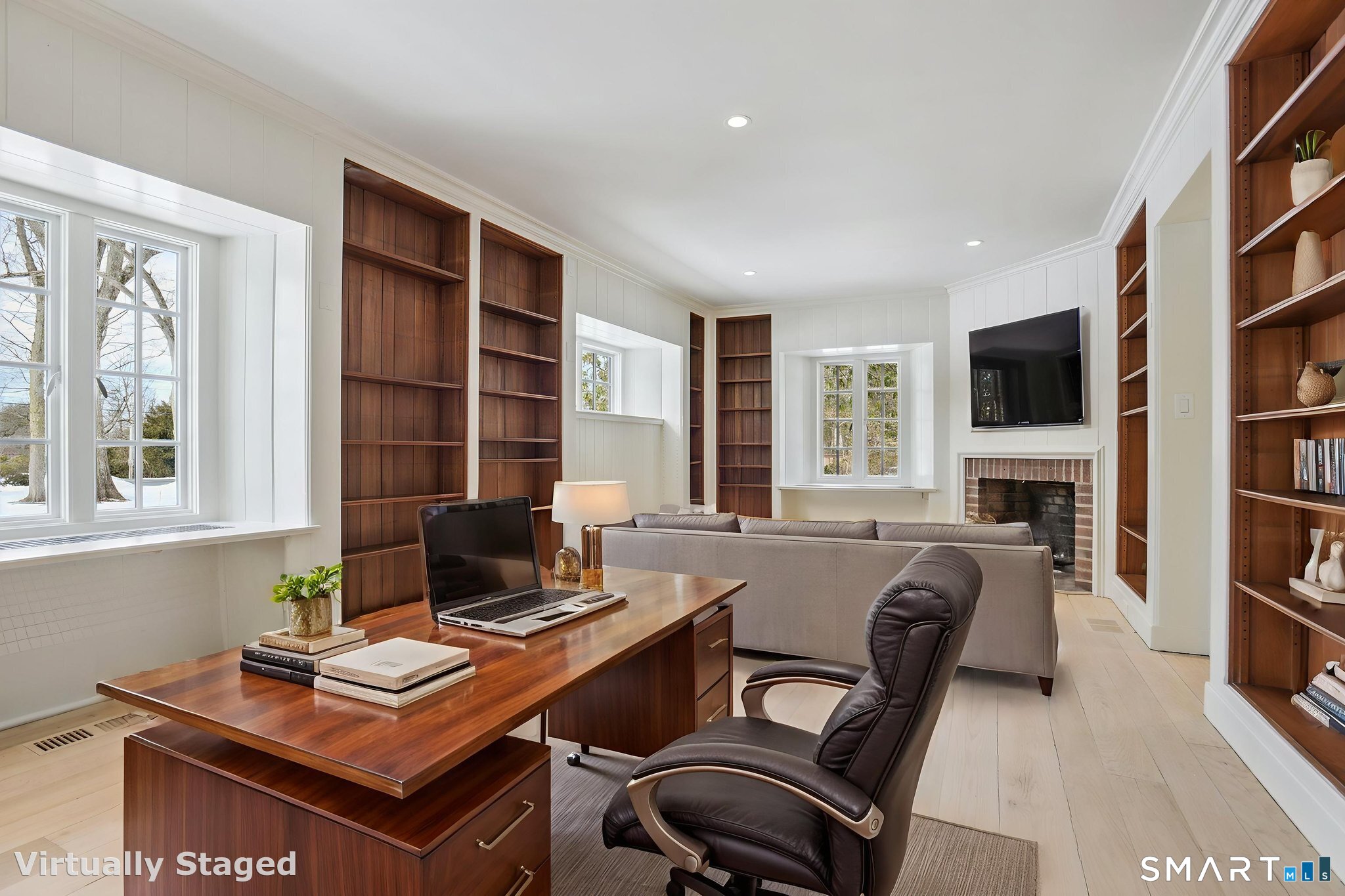 1085 Ridge Road Hamden, CT 06517 - Photo 12 of 41 Warm and inviting first floor library offers built-in bookcases and even has a fireplace