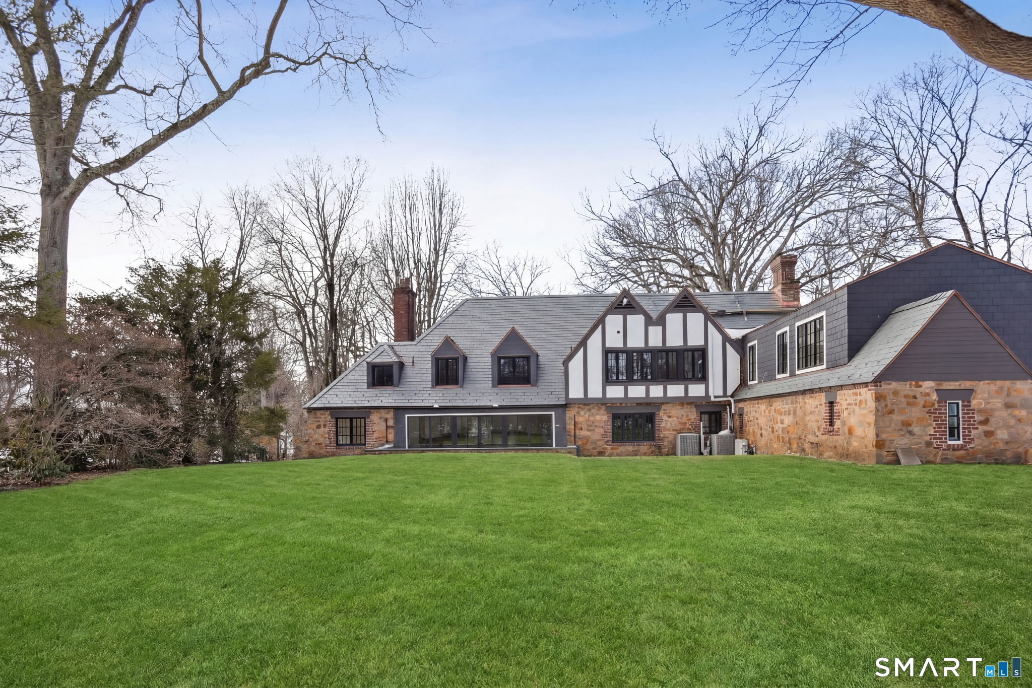 1085 Ridge Road Hamden, CT 06517 - Photo 35 of 41 The deep back yard offer a view of the back of the house