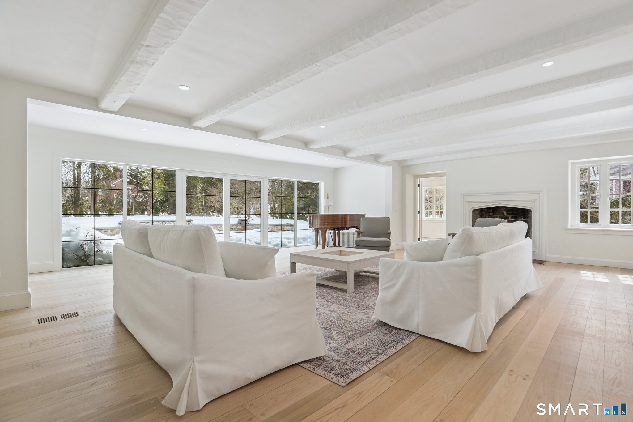 1085 Ridge Road Hamden, CT 06517 - Photo 4 of 41 A large wall of glass leads to a gracious stone patio and is ideal for indoor/outdoor living