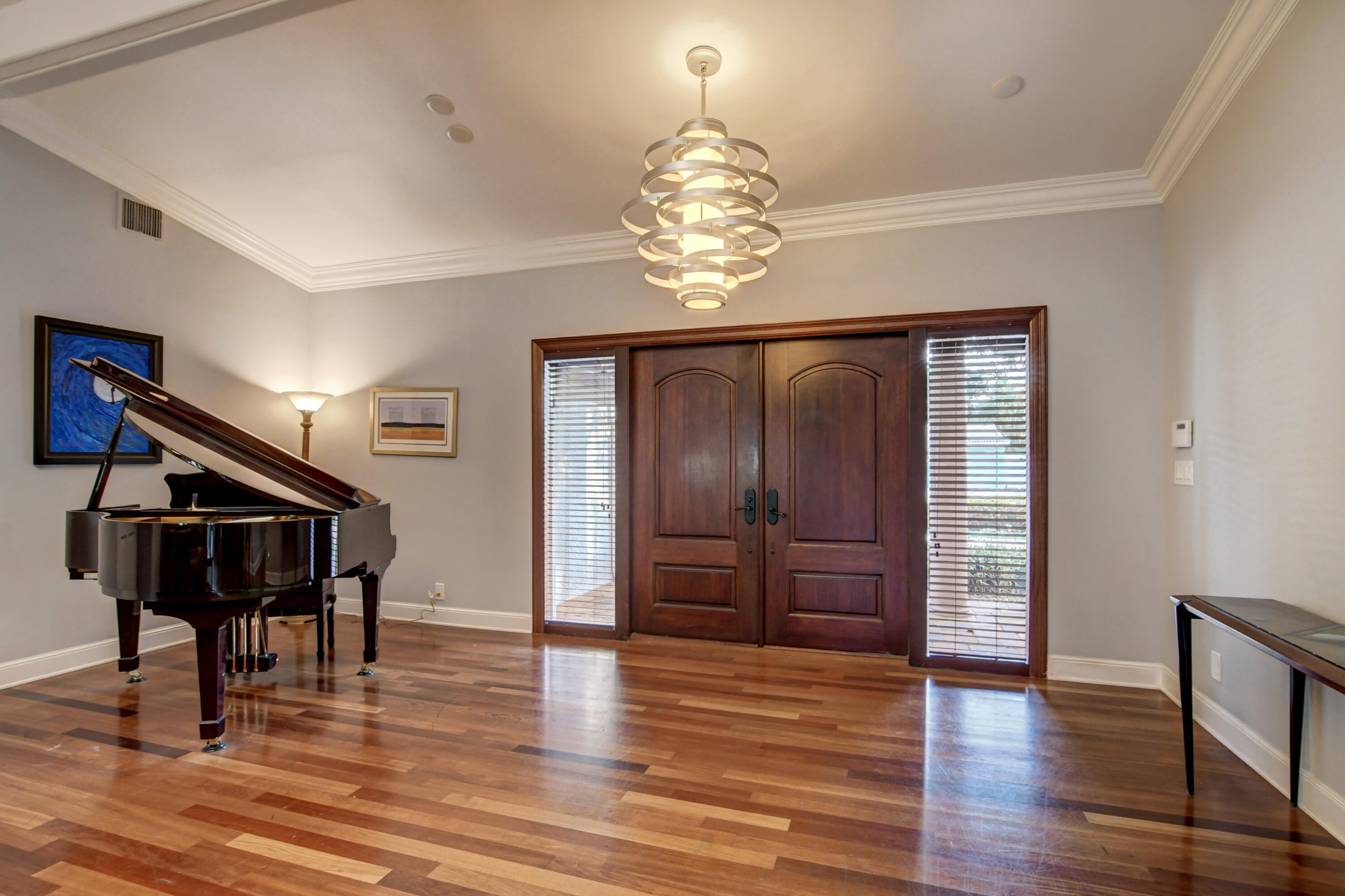 921 Southwest 20th Street Boca Raton, FL 33486 - Photo 8 of 56 a view of an empty room with wooden floor and stairs
